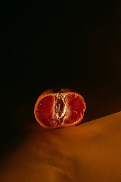 orange fruit on yellow textile