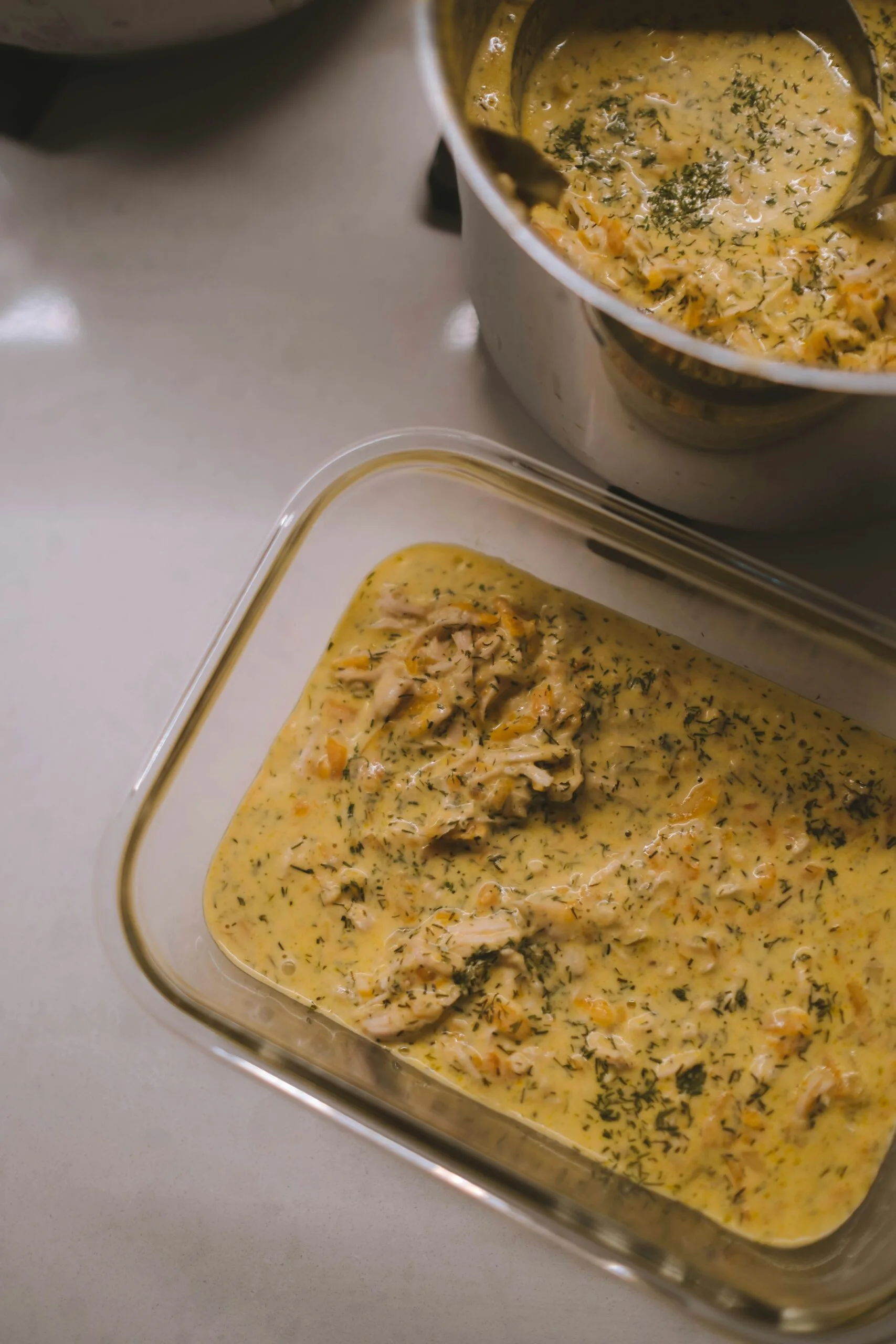 white plastic container with brown food